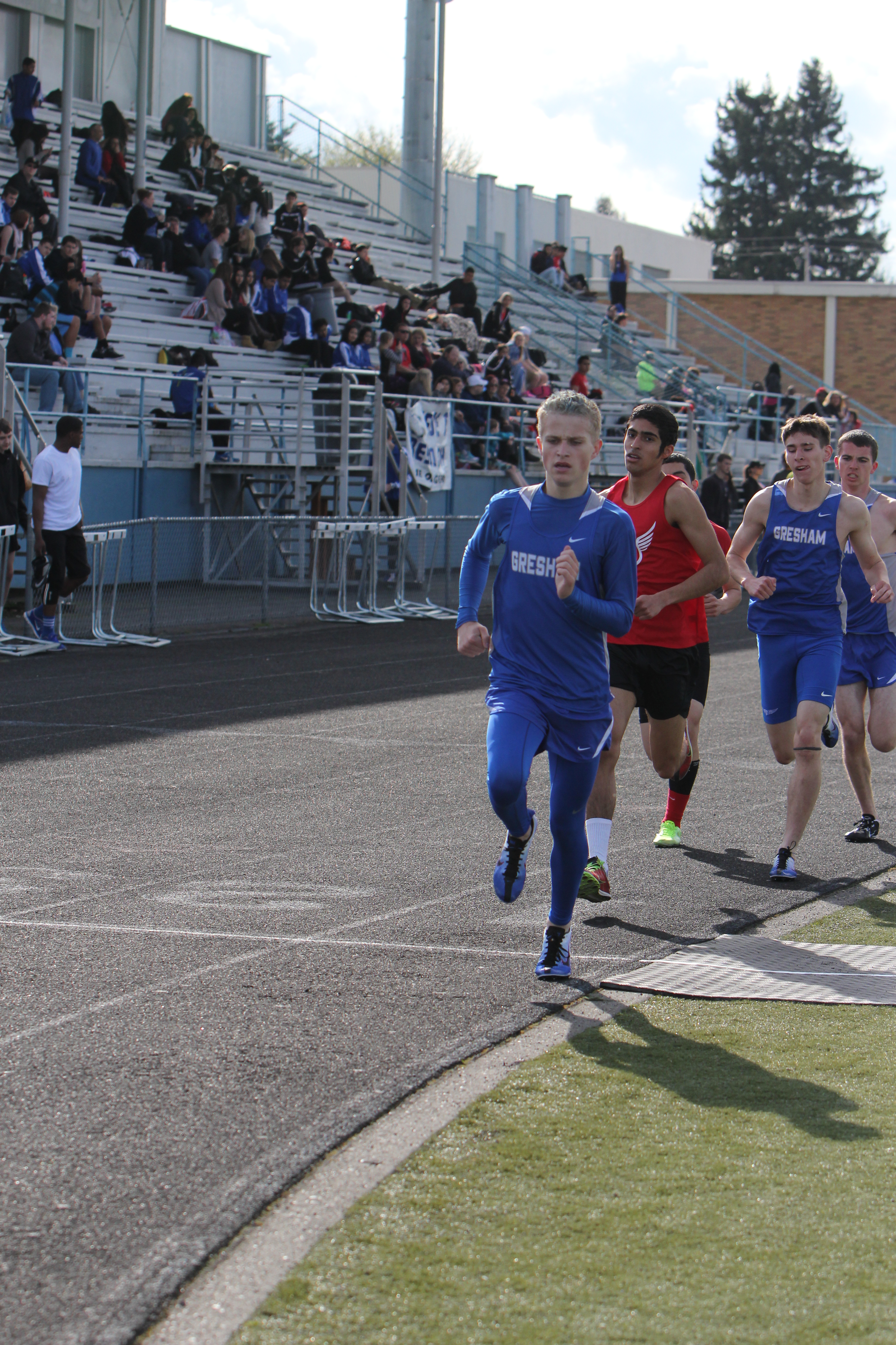 Photo by Teilah Heston Junior Troy Ryals lead the men's varsity 1500m for a short while, followed by seniors Gage Schreiner and Tucker George. George ended the race in first with a time of 4:27.
